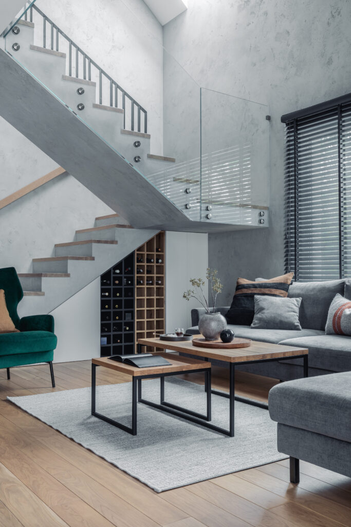 stylish-composition-living-room-interior-grey-sofa-green-velvet-armchair-coffee-table-minimalist-personal-accessories-modern-home-decor-template